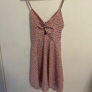 Tight on top and flowey at the bottom pink with white flowers